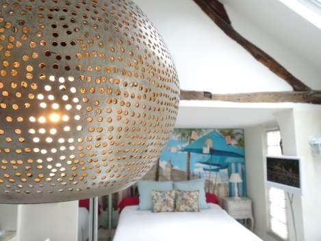 Detail of the pendant lamp from Egypt hanging over the kitchen counter. Photo: ©Lisa Anselmo