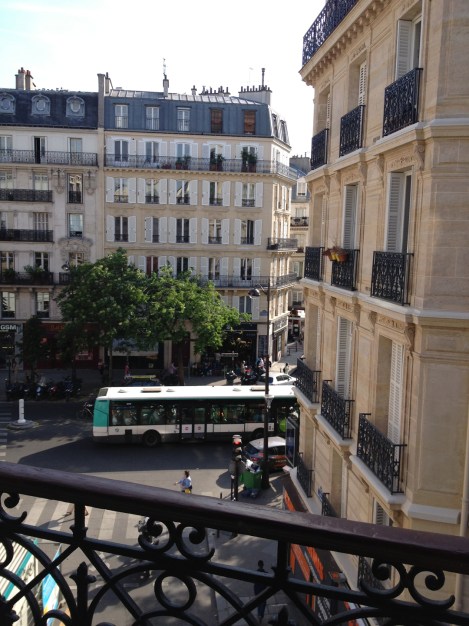 Bus rumbles by on the boulevard in this classic Parisian view. ©Lisa Anselmo