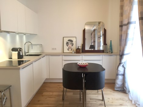 My new kitchen, at last. The drawing perched beside the mirror is of Liza Minnelli by my friend, artist Geoffrey Guillin, who calls me, "Liza."