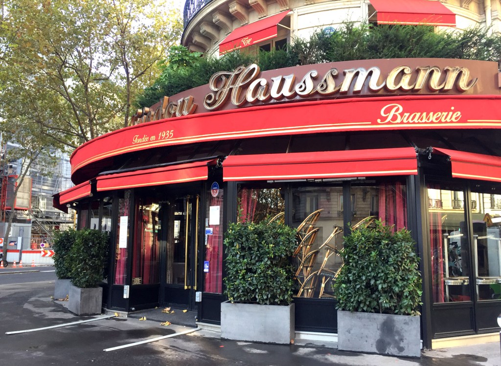 Triadou Haussmann cafe, closed during Covid, chairs stacked inside
