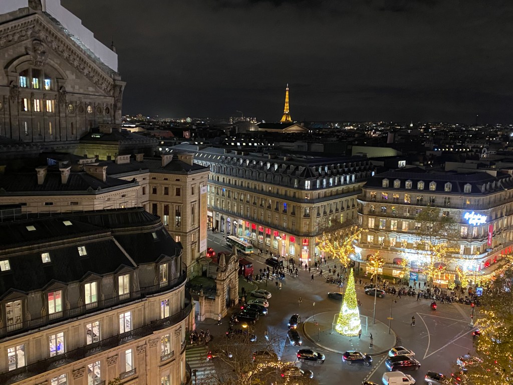 View over the rooftops of Paris and the Eiffel Tower from the roof deck of Galeries Lafayette